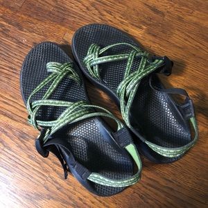Selling Chacos with green double-straps and toe loop for a customized fit.